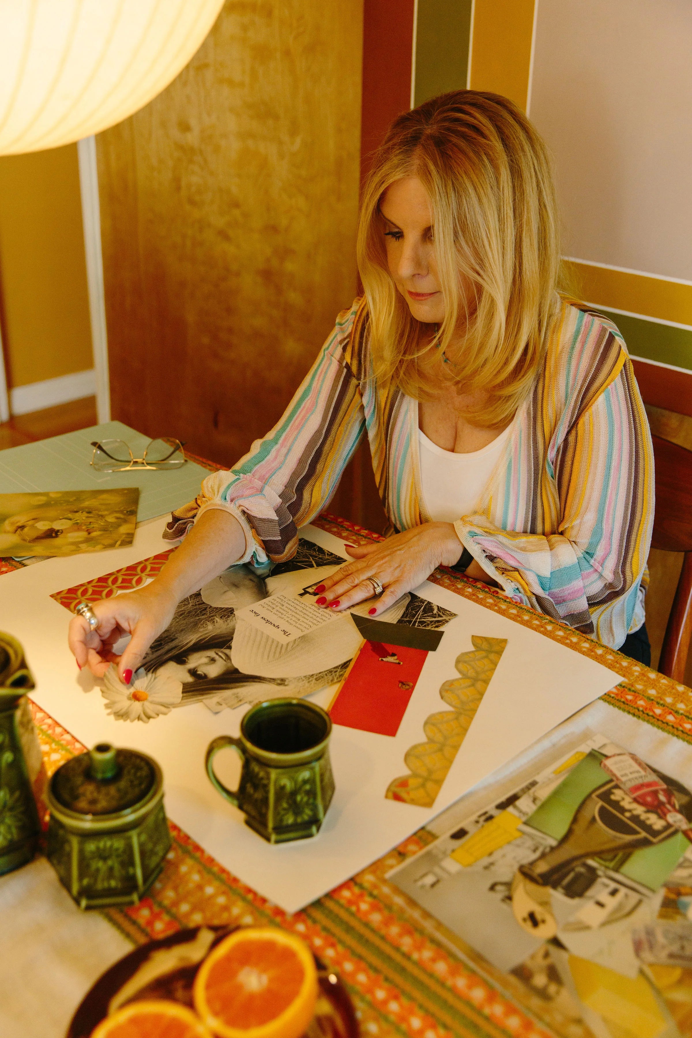 Kristi Klein working on hand-cut analog collage art